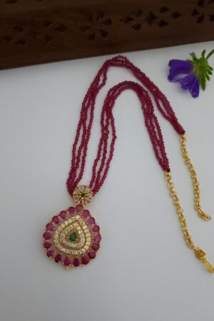 Ruby Spinner With Multi Colored Pendent